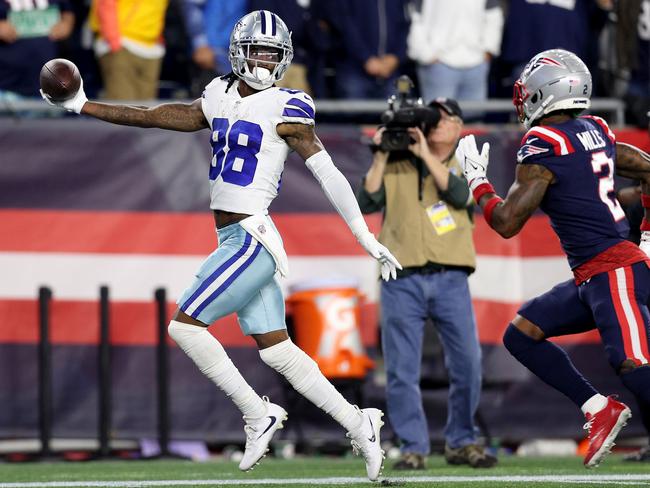 FOXBOROUGH, MASSACHUSETTS - OCTOBER 17: CeeDee Lamb #88 of the Dallas Cowboys celebrates after catching the game-winning touchdown against Jalen Mills #2 of the New England Patriots in overtime at Gillette Stadium on October 17, 2021 in Foxborough, Massachusetts. The Cowboys defeated the Patriots 35-29 in overtime. (Photo by Maddie Meyer/Getty Images)