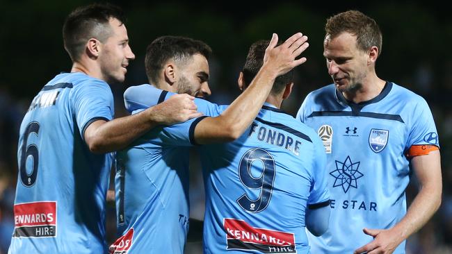 Adam Le Fondre (second right) celebrates scoring for Sydney FC against the Roar. Picture: Getty Images