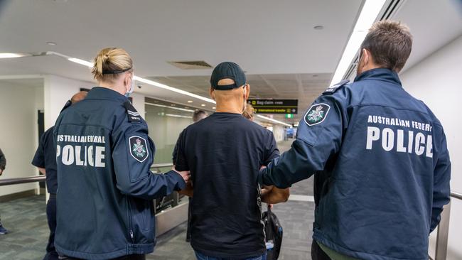 Australian Federal Police escort Chung Chak Lee at Melbourne Airport before he appeared in court. Picture: Supplied.