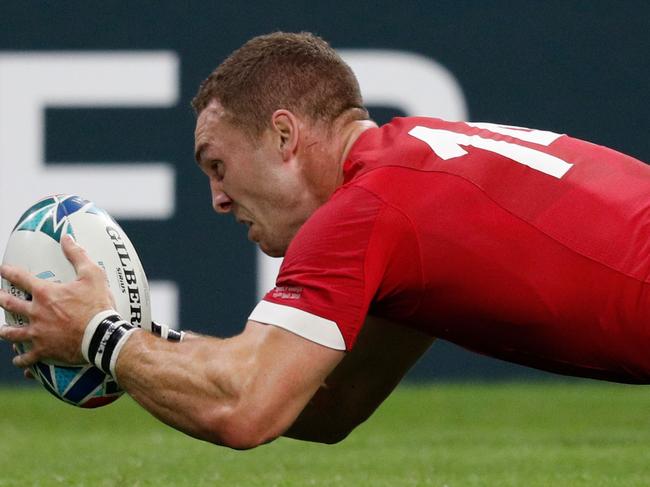 TOPSHOT - Wales' wing George North scores a try  during the Japan 2019 Rugby World Cup Pool D match between Wales and Georgia at the City of Toyota Stadium in Toyota City on September 23, 2019. (Photo by Adrian DENNIS / AFP)