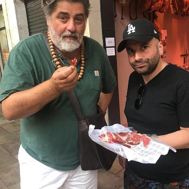 Boys trip … MasterChef judges Matt Preston and George Calombaris sample prosciutto on their world foodie trip. Picture: Instagram