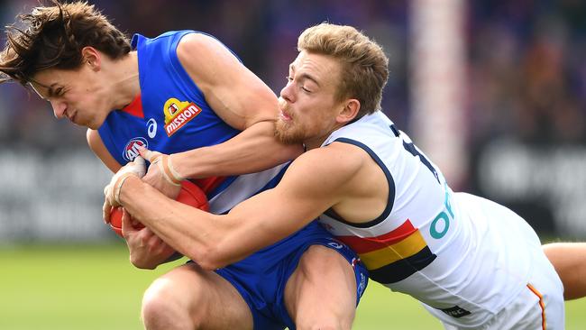 GOTCHA: Out-of-contract Crow Hugh Greenwood lays a crunching tackle on the Western Bulldogs’ Patrick Lipinski in the round 23 clash at Ballarat. Picture: QUINN ROONEY (Getty Images).