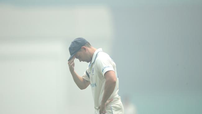 Stephen O'Keefe reacts as smoke blankets the SCG. Picture. Phil Hillyard