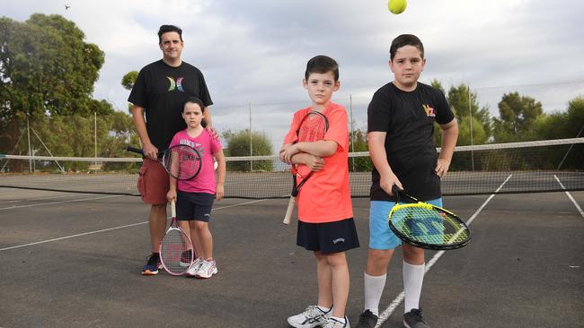 Friends of McConnell member Travis Smith and his family opposing plans to sell part of McConnell Reserve in 2017. Travis is pictured with his twins Maeve and Angus and neighbour Patrick Wesson. Picture: Naomi Jellicoe