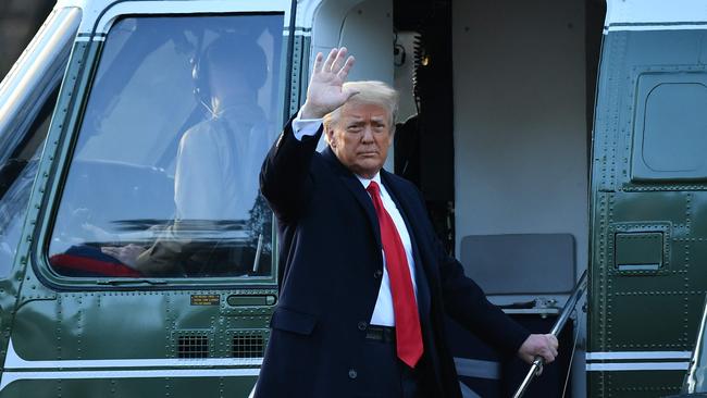 Outgoing US President Donald Trump waves as he boards Marine One at the White House in Washington on Wednesday. Picture: AFP