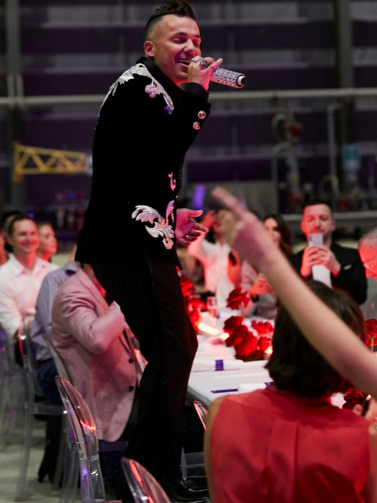 Anthony Callea performs at the launch of Virgin Australia's new business-class menu in the Virgin hangar at Brisbane Airport. Picture: Carly Ravenhall