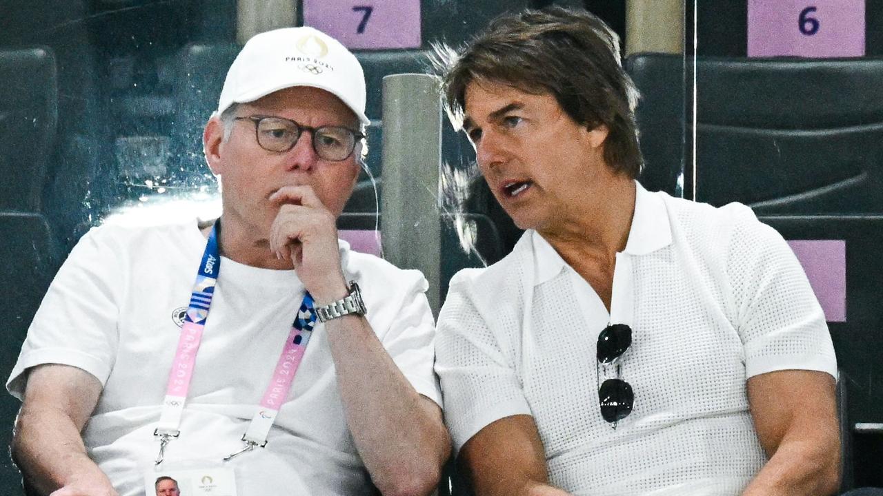 US actor Tom Cruise (R) speaks with Warner Bros CEO David Zaslav (L) as they attend the artistic gymnastics women's qualification. Picture: AFP