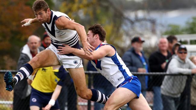 Jackson Clarke (right) tackles Bundoora’s Matt Dennis. Picture: Mark Dadswell.