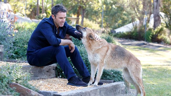 Brad Fittler pictured at home with his dog Evie in 2018. Picture: David Swift.