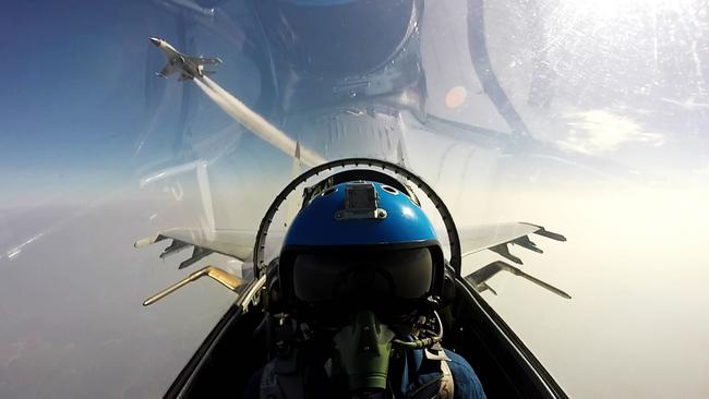 Two Chinese jet fighters during a military drill in the South China Sea. Picture: AFP