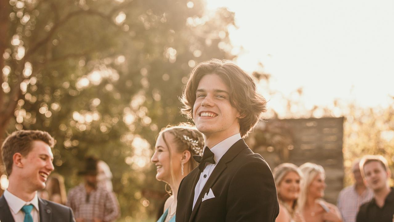 Glasshouse Christian College Ethan Rees with Ebony King and Liam McMichael in the background, enjoying the ambience of The Rocks in Yandina. Picture: Jordan Bull