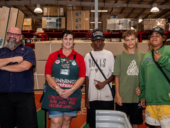 Neil Gray, Trish Visser, Antonio Cubillo, Leslie Turley Jr and Israel Shadforth as groups of teenagers is building raised garden beds for a new local domestic violence shelter as Bunnings Palmerston in partnership with Grassroots Aboriginal Corporation. Picture: Pema Tamang Pakhrin