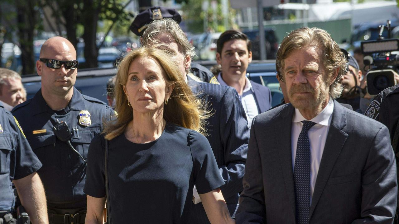 Actress Felicity Huffman, escorted by her husband William H. Macy, makes her way to the entrance of the John Joseph Moakley United States Courthouse September 13, 2019 in Boston. Picture: Joseph Prezioso / AFP.