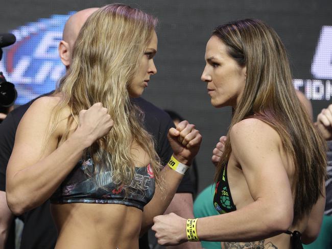 Ronda Rousey, left, and Alexis Davis during a weigh-in for the UFC 175 mixed martial arts event in Las Vegas.