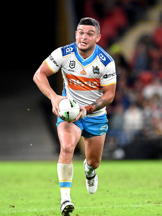 BRISBANE, AUSTRALIA - APRIL 30: Ash Taylor of the Titans runs with the ball during the round 8 NRL match between the Brisbane Broncos and the Gold Coast Titans at Suncorp Stadium, on April 30, 2021, in Brisbane, Australia. (Photo by Bradley Kanaris/Getty Images)