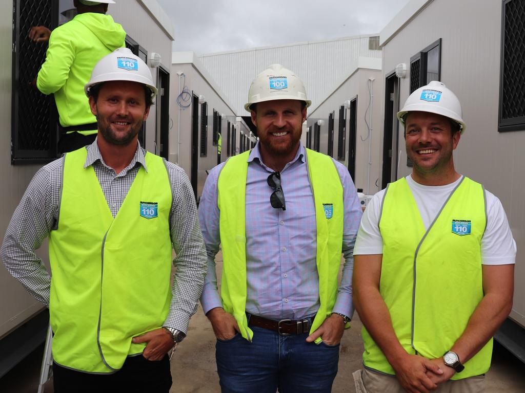 Hutchinson Builders’ project manager Gavin Taylor, team leader Sean Lees and contracts administrator Rian Cherry at the Harristown base of operations for their construction work putting together the modules that form accommodation at the Wellcamp quarantine facility.