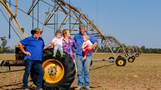 Chris Brooks (left) father of Carly Marriott (third from left), Carly's husband Tom Marriott (second from right) and their daughters 2 year old Kate Marriott (second from left) and 1 year old Jemima Marriott (right) from Boomanoomana, NSW at their property on the boundary of the Mulwala Canal part of the Murray Irrigation district. Picture: Simon Dallinger