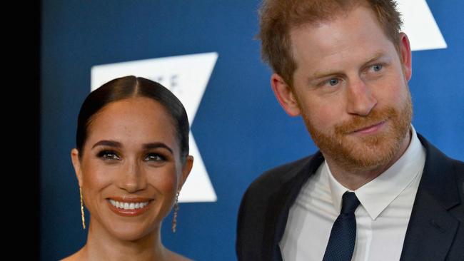 (FILES) Prince Harry, Duke of Sussex, and Meghan, Duchess of Sussex, arrive at the 2022 Robert F. Kennedy Human Rights Ripple of Hope Award Gala at the Hilton Midtown in New York City on December 6, 2022. Prince Harry and wife Meghan Markle were involved in a "near catastrophic car chase" involving paparazzi in New York late on May 16, 2023, a spokesperson for the couple said May 17. "This relentless pursuit, lasting over two hours, resulted in multiple near collisions involving other drivers on the road, pedestrians and two NYPD officers," the spokesperson added. (Photo by ANGELA WEISS / AFP)