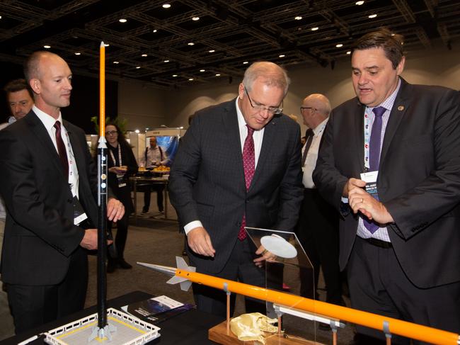 Southern Launch’s Lloyd Damp and DEWC System’s Ian Spencer outline their rocket launch deal to Prime Minister Scott Morrison last year. Picture: James Knowler