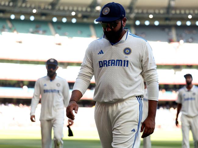 India's Rohit Sharma leaves the field at the close of play on day four of the fourth cricket Test match between Australia and India at the Melbourne Cricket Ground (MCG) in Melbourne on December 29, 2024. (Photo by Martin KEEP / AFP) / — IMAGE RESTRICTED TO EDITORIAL USE – STRICTLY NO COMMERCIAL USE —