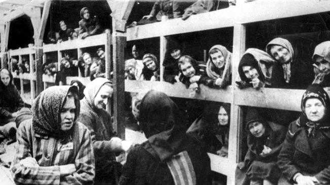 The interior of a women's barrack after the Auschwitz camp liberation.