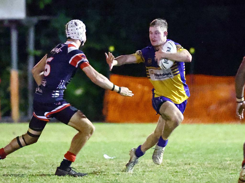 Roos' Malique Douthat puts up a big fend in the Far North Queensland Rugby League (FNQRL) Men's minor semi final match between the Atherton Roosters and the Cairns Kangaroos, held at Smithfield Sporting Complex. Picture: Brendan Radke