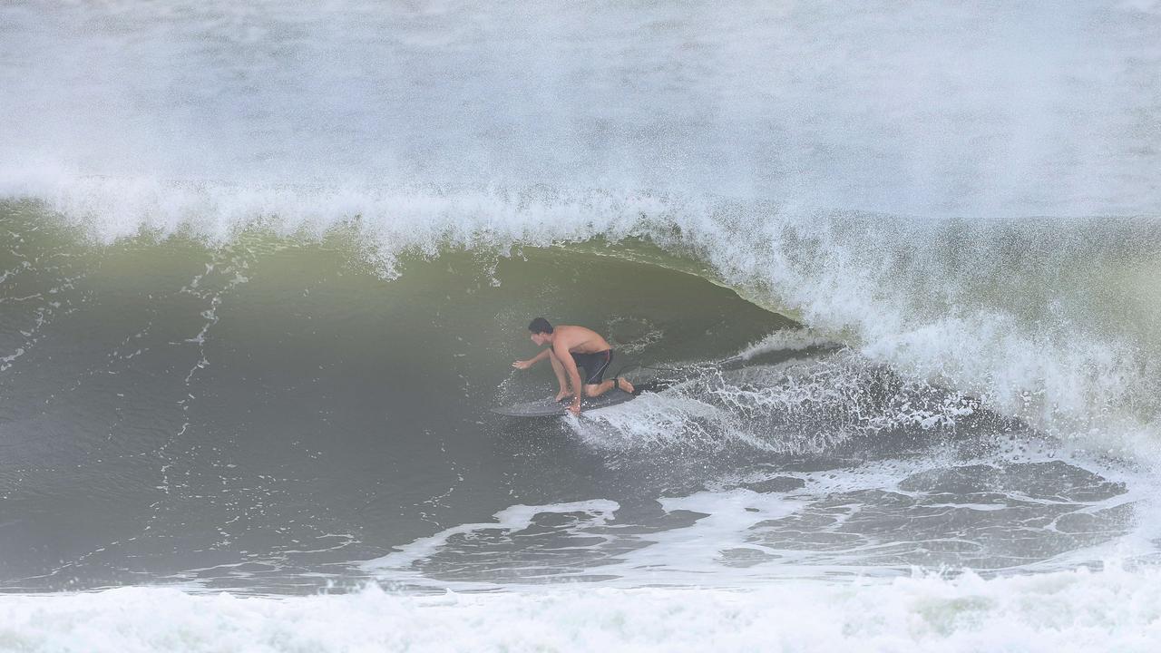 Thousands of people are out and about to watch the swell at Kirra as Cylcone Alfred sits off the coast. Pics Adam Head