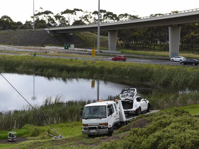 It is believed the car crashed through a barrier, careened down a hill and plunged into the wetlands. Picture: Tony Gough