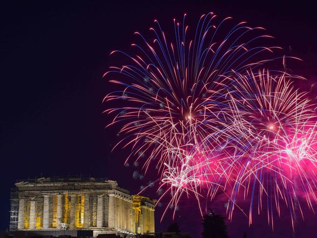 Fireworks explode over the ancient temple of the Parthenon on top of the Acropolis hill. Picture: AFP