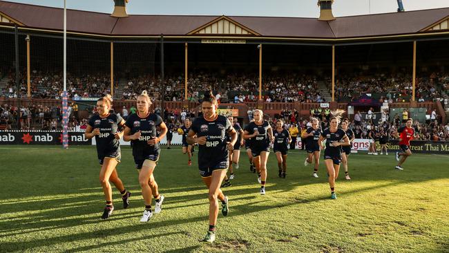 Adelaide runs out at Norwood Oval before its AFLW match against the Western Bulldogs. Picture: AFL Media/Getty Images