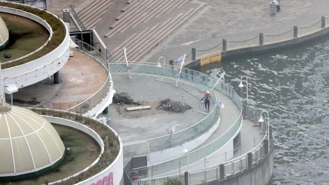 March 2023: Workers on site during the demolition of Eagle Street Pier. Picture: Steve Pohlner