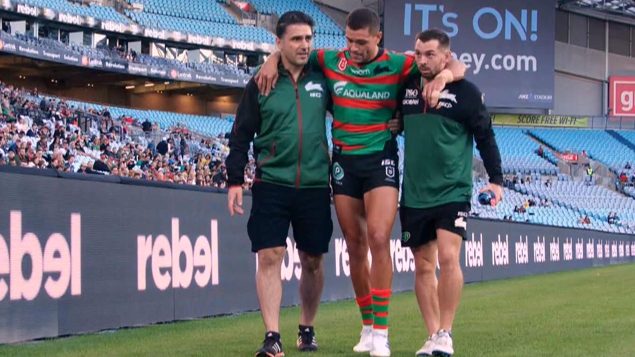 Braidon Burns leaves the field injured.