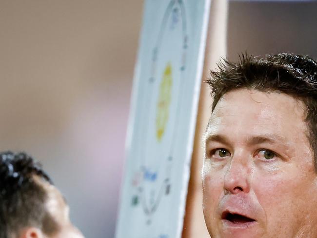 DARWIN, AUSTRALIA - JUNE 03: Stuart Dew, Senior Coach of the Suns addresses his players during the 2023 AFL Round 12 match between the Gold Coast Suns and the Adelaide Crows at TIO Stadium on June 3, 2023 in Darwin, Australia. (Photo by Dylan Burns/AFL Photos via Getty Images)