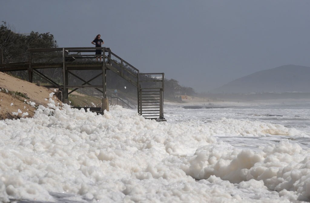 Foam covers Maroochydore Beach after heavy rain and large seas. Picture: Brett Wortman