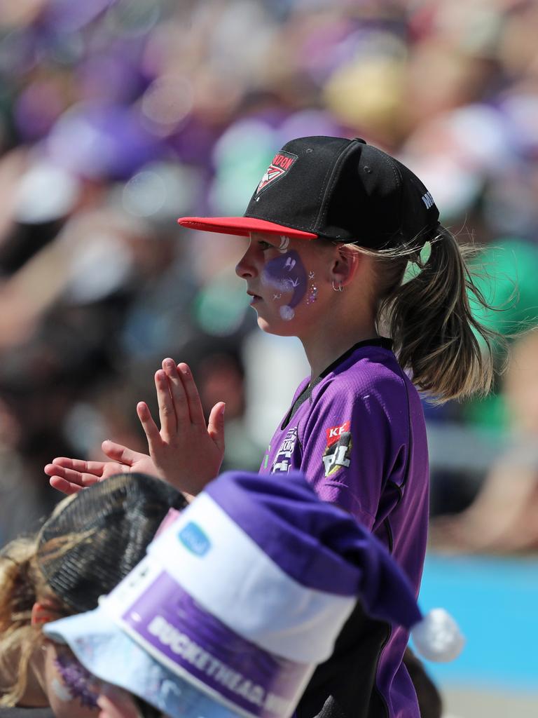 Fans enjoying the hot weather at the Big Bash match between the Hurricanes and Melbourne Stars at Blundstone Arena on Christmas Eve. Picture: LUKE BOWDEN