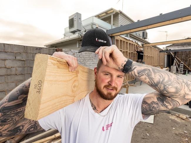 Carpenter Jack Gale, 27, on a hot worksite. A new Aussie invention, the Wear Optimo, promises to provide outdoor workers and athletes real-time information on the effects of heat stress. Picture: Jason Edwards