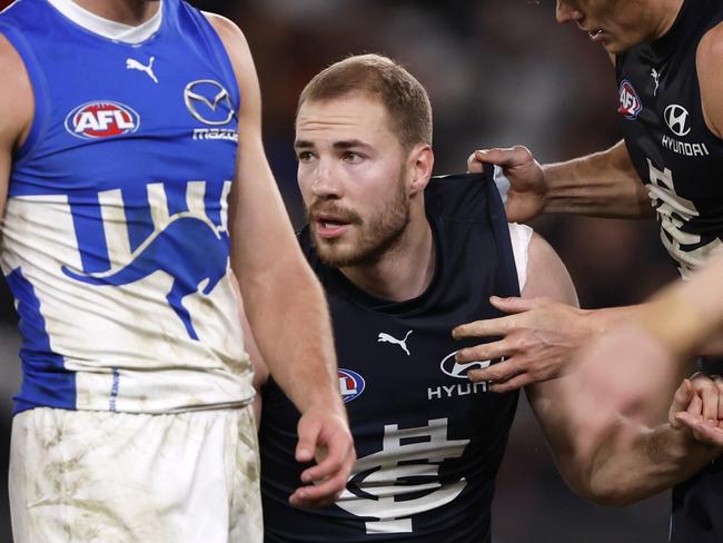 MELBOURNE, AUSTRALIA - JULY 21:  Harry McKay of the Blues is helped to his feet after a heavy collision during the round 19 AFL match between Carlton Blues and North Melbourne Kangaroos at Marvel Stadium, on July 21, 2024, in Melbourne, Australia. (Photo by Darrian Traynor/Getty Images)