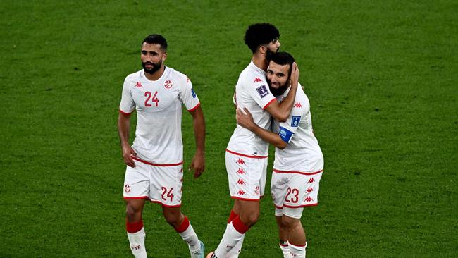 (From L) Tunisia's defender #24 Ali Abdi, Tunisia's midfielder #13 Ferjani Sassi and Tunisia's forward #23 Naim Sliti