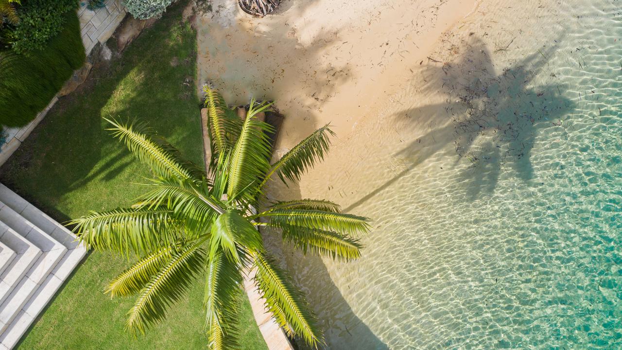 The house has a private sandy beach.