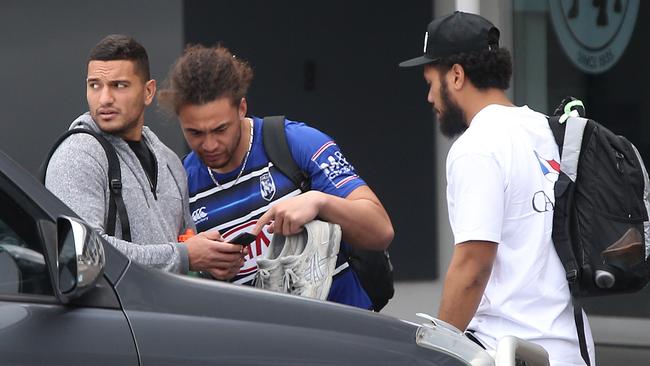 Canterbury Bankstown players Asipeli Fine (right) and Marcelo Montoya (left) arrive at Belmore headquarters on Thursday.