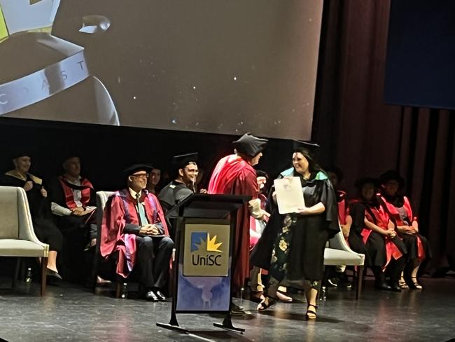 Graduates from the University of the Sunshine Coast's Fraser Coast campus celebrating at the Brolga Theatre.