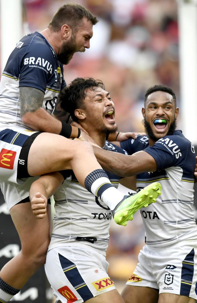 Nanai (middle) and Tabuai-Fidow (right) were teammates with North Queensland Cowboys for two seasons. They’re pictured celebrating with Kyle Feldt in 2022. Picture: NRL Images