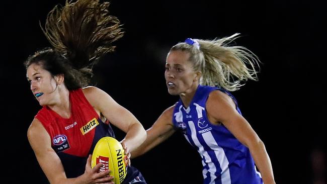 Gabrielle Colvin tries to evade North Melbourne’s Kaitlyn Ashmore.