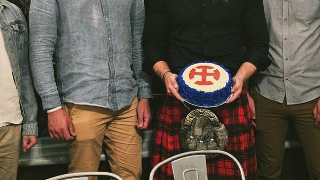 Members of the Tasmanian European Australian Movement chapter with a cake for Hitler's birthday. Picture: Supplied