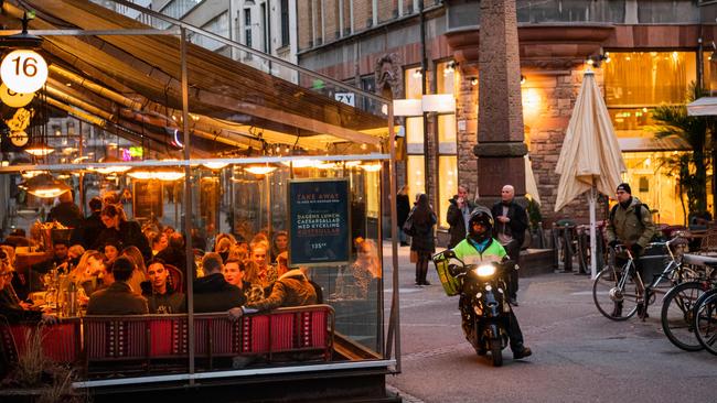 People dine in a restaurant in Stockholm last week. Picture: AFP