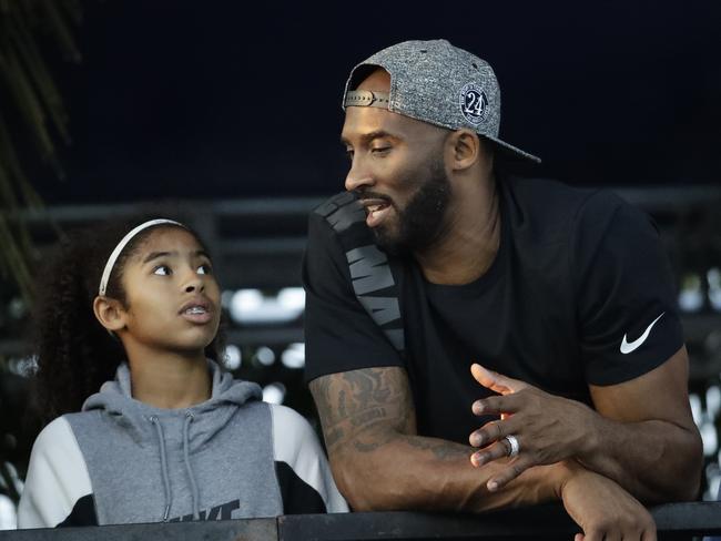 Former Los Angeles Laker Kobe Bryant and his daughter Gianna watch the U.S. national championships swimming meet. Picture: AP