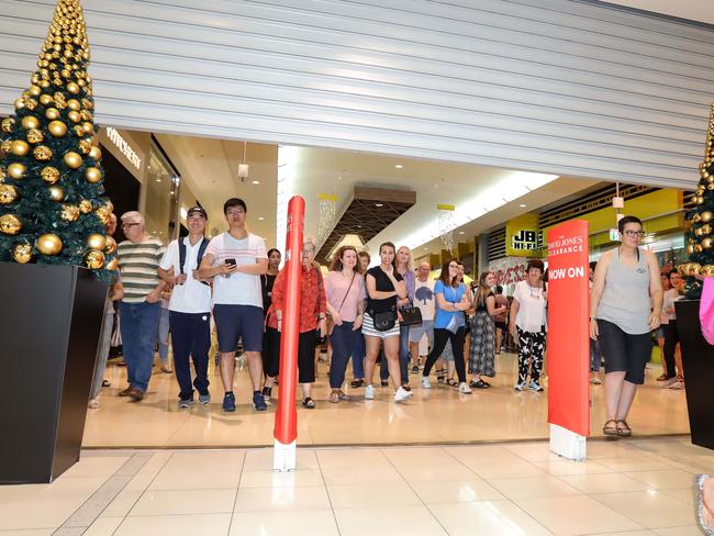 News ADV Early morning sales shoppers enter David Jones Marion store at 9.00am Photo AAP/Russell Millard