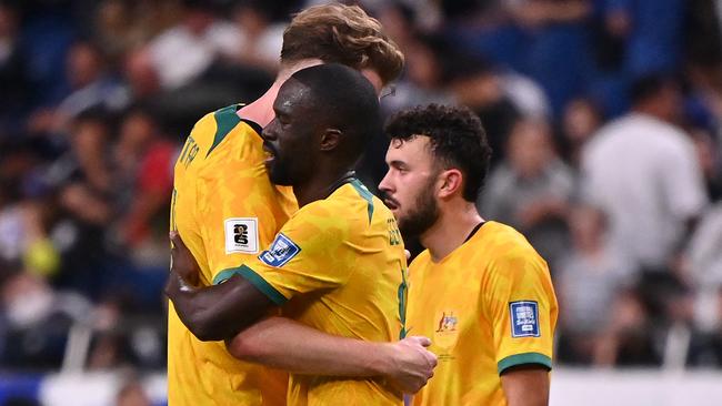 SAITAMA, JAPAN - OCTOBER 15: Harry Souttar, Jason Geria and Patrick Yazbek of Australia react after the 1-1 draw in the FIFA World Cup Asian Third Qualifier Group C match between Japan and Australia at Saitama Stadium on October 15, 2024 in Saitama, Japan.  (Photo by Kenta Harada/Getty Images)