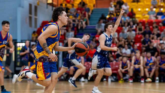 William Burton dribbles the ball. Darwin Basketball Men's Championship Round 20: Ansett v Tracy Village Jets. Picture: Che Chorley