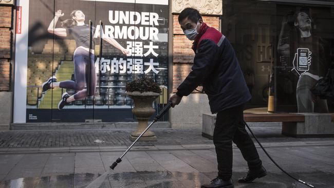 A cleaner washes a street in Wuhan, Hubei province, China. Picture: GETTY IMAGES